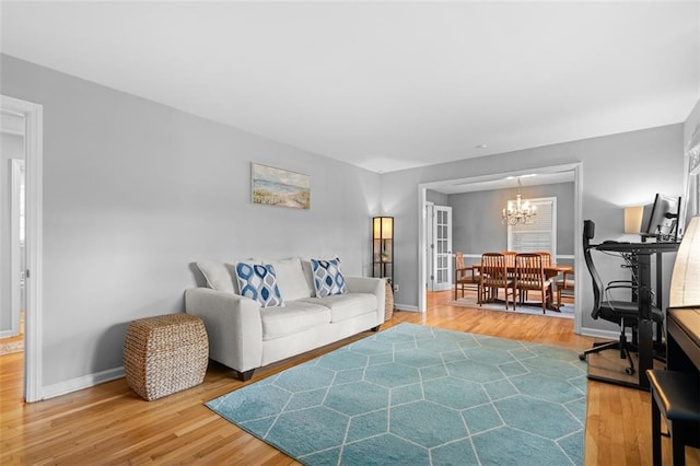 1959 Audubon Dr NE, Atlanta, GA 30329 - living room featuring a chandelier and light wood-style floors