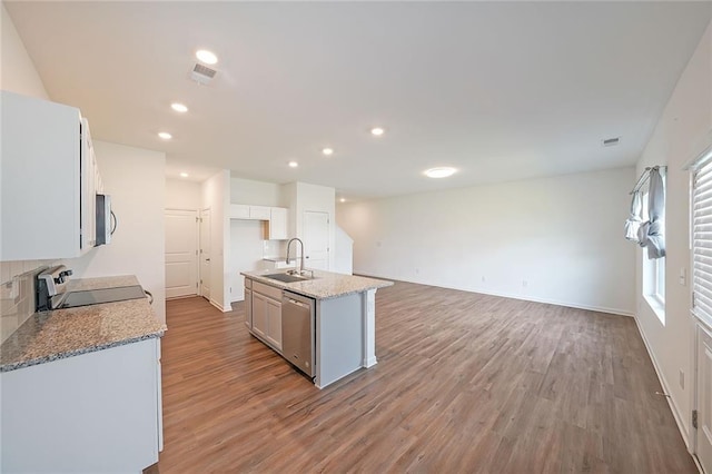 kitchen with light stone countertops, sink, light hardwood / wood-style flooring, dishwasher, and range