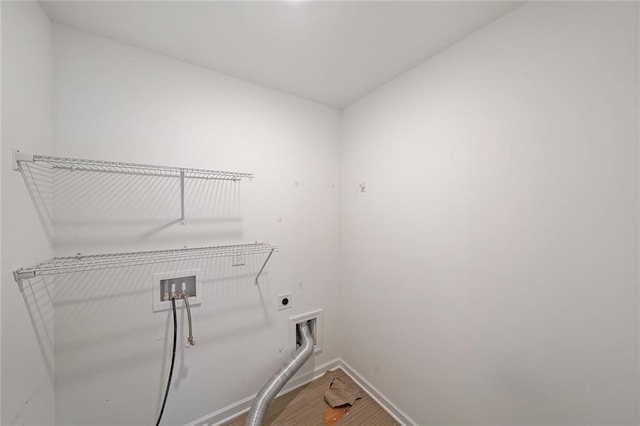 clothes washing area featuring hookup for an electric dryer, hardwood / wood-style floors, and hookup for a washing machine