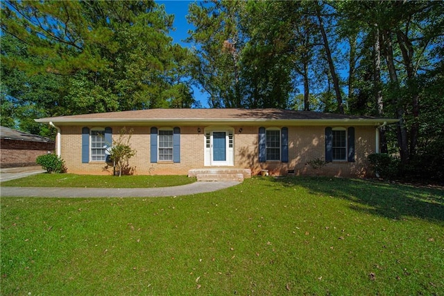 ranch-style home with brick siding and a front lawn
