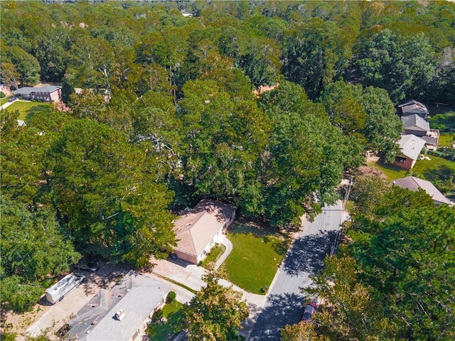 drone / aerial view featuring a wooded view