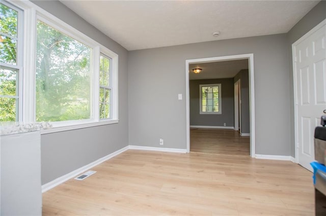 8211 Thompson St, Douglasville, GA 30134 - interior space with visible vents, light wood-style flooring, and baseboards
