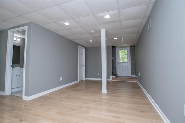 8211 Thompson St, Douglasville, GA 30134 - interior space with light wood-type flooring, a paneled ceiling, baseboards, and recessed lighting