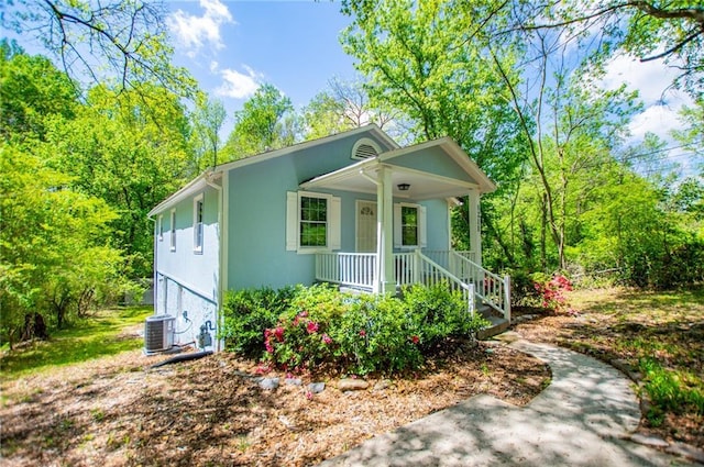 8211 Thompson St, Douglasville, GA 30134 - bungalow featuring central AC, a porch, and stucco siding