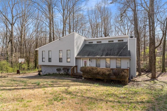 view of front of home with a front lawn and a chimney