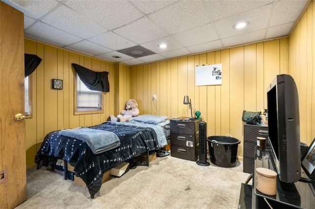 carpeted bedroom featuring a paneled ceiling