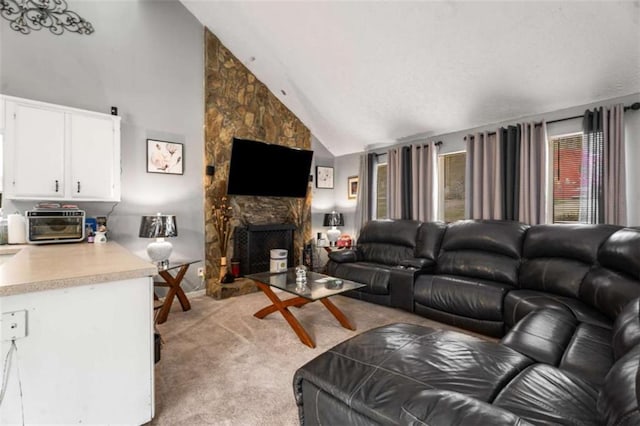 living room featuring light carpet, high vaulted ceiling, and a fireplace