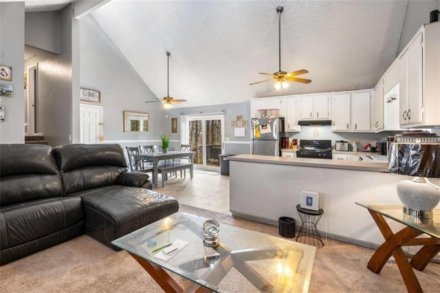 living room with a textured ceiling, beamed ceiling, a ceiling fan, and high vaulted ceiling