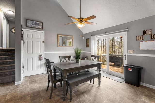 dining space featuring stairway, baseboards, a textured ceiling, and ceiling fan