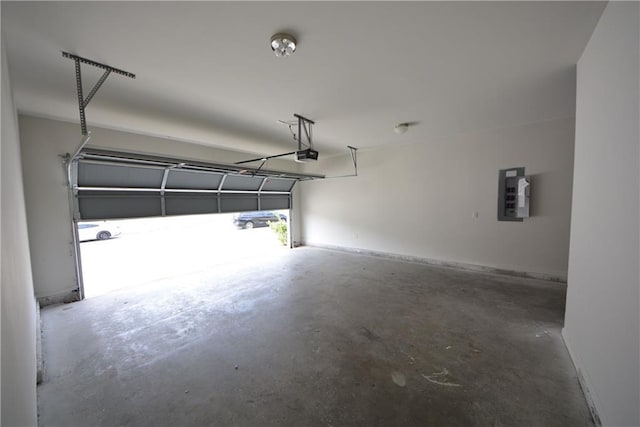 garage with electric panel and a garage door opener