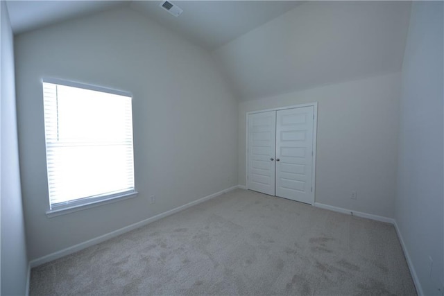 bonus room featuring visible vents, baseboards, carpet, and vaulted ceiling