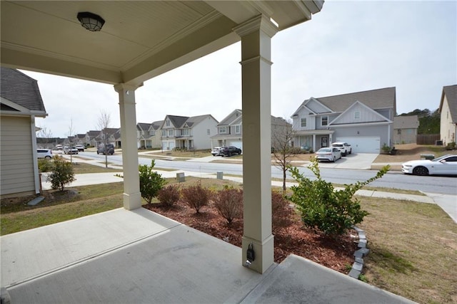 view of patio / terrace featuring covered porch and a residential view