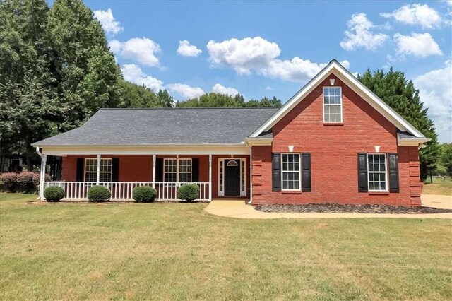 view of front of house featuring a front yard and a porch