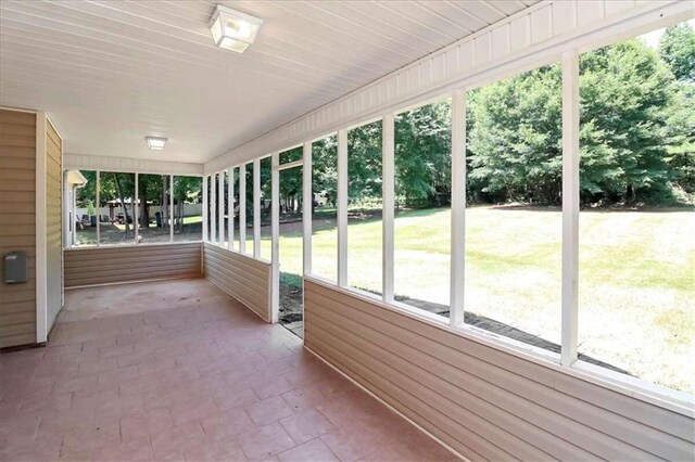 unfurnished sunroom featuring a healthy amount of sunlight