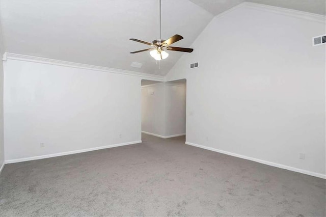 carpeted empty room featuring ceiling fan, crown molding, and high vaulted ceiling