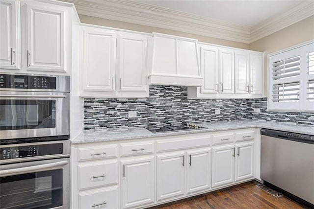 kitchen featuring stainless steel appliances, dark wood-type flooring, white cabinets, tasteful backsplash, and custom range hood