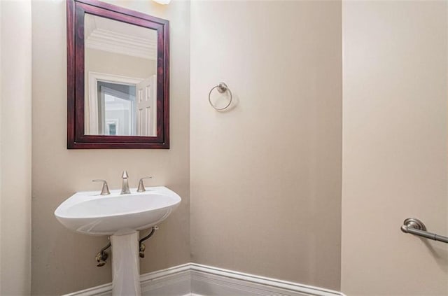 bathroom with baseboards