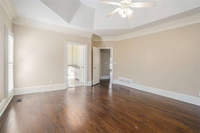 spare room with baseboards, visible vents, wood finished floors, and ornamental molding