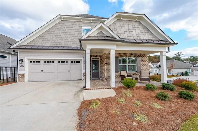 craftsman-style house featuring a porch and a garage