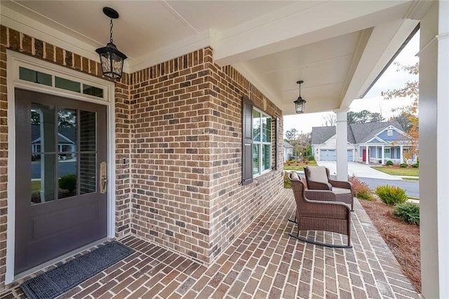 entrance to property featuring a porch