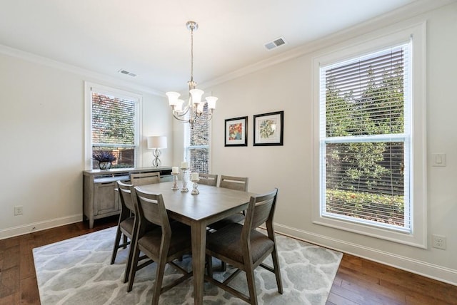 dining room with wood-type flooring and a wealth of natural light