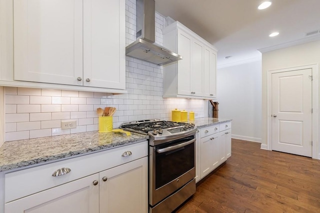 kitchen with white cabinetry, wall chimney exhaust hood, dark wood-type flooring, and stainless steel gas range