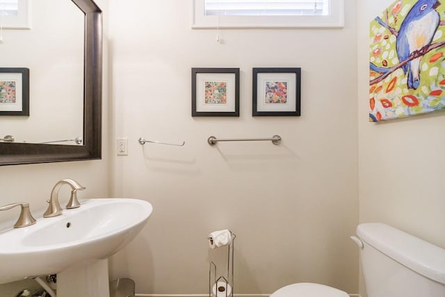 bathroom featuring toilet and sink