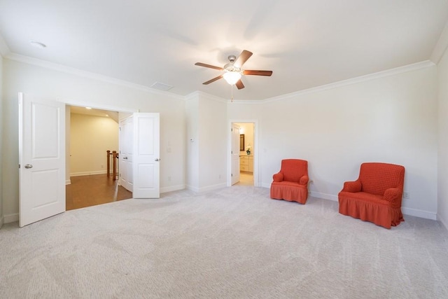 living area featuring ceiling fan, crown molding, and light carpet