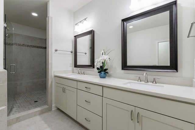 bathroom featuring vanity and an enclosed shower