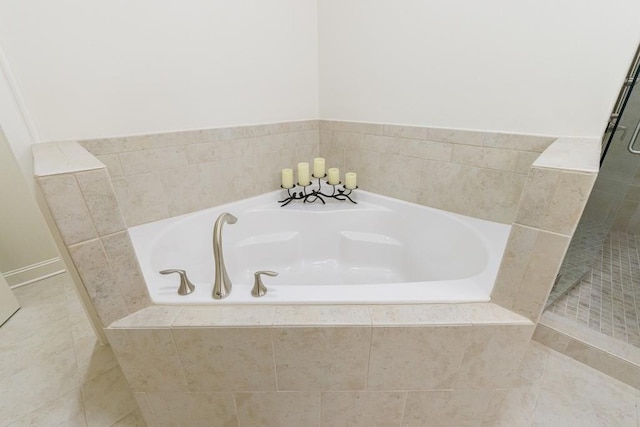 bathroom featuring tile patterned floors and plus walk in shower