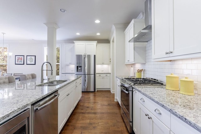 kitchen featuring dark wood-type flooring, white cabinets, sink, wall chimney exhaust hood, and stainless steel appliances