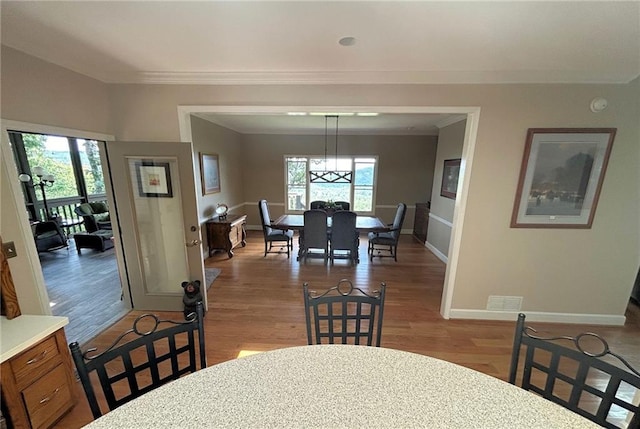 dining room with light hardwood / wood-style flooring