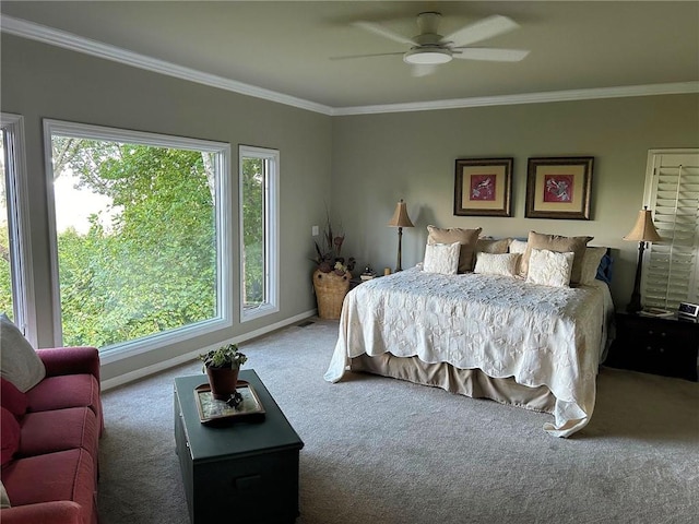 bedroom with carpet floors, ornamental molding, and ceiling fan