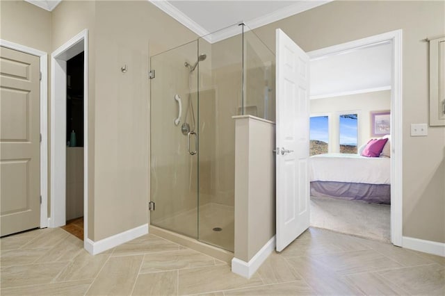 bathroom with tile patterned floors, a shower with door, and ornamental molding