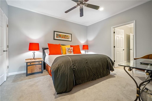 bedroom featuring ceiling fan, ornamental molding, and light colored carpet