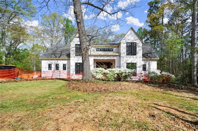 1430 Oconee Pass NE, Brookhaven, GA 30319 - rear view of property featuring stucco siding, a yard, and roof with shingles