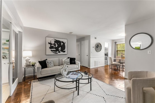 living room featuring parquet floors