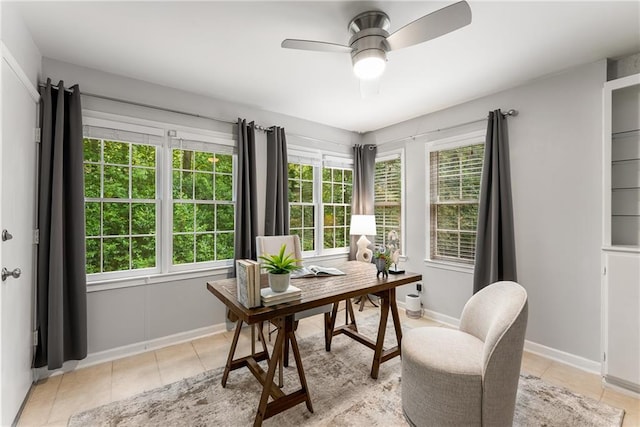 office area featuring a wealth of natural light, ceiling fan, and light tile patterned flooring