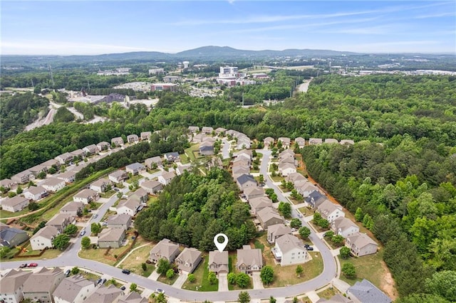 birds eye view of property featuring a mountain view