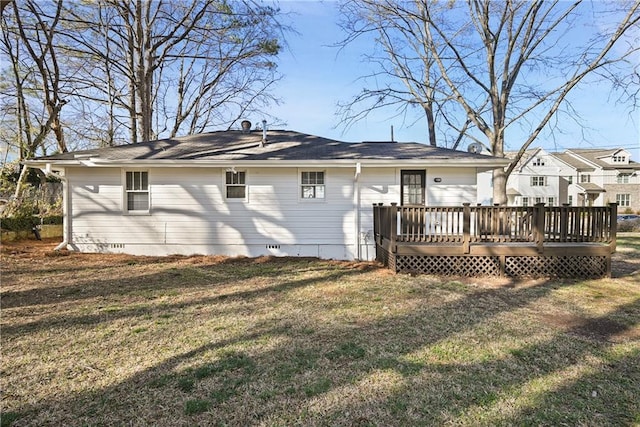 back of property featuring crawl space, a lawn, and a wooden deck