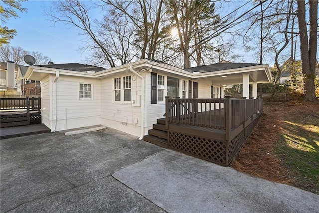 view of front of property featuring a patio area and a deck