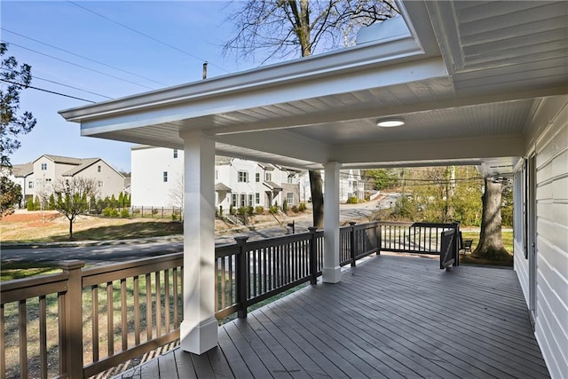 wooden deck featuring a residential view