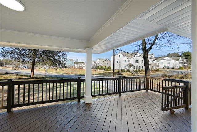 wooden deck with a residential view