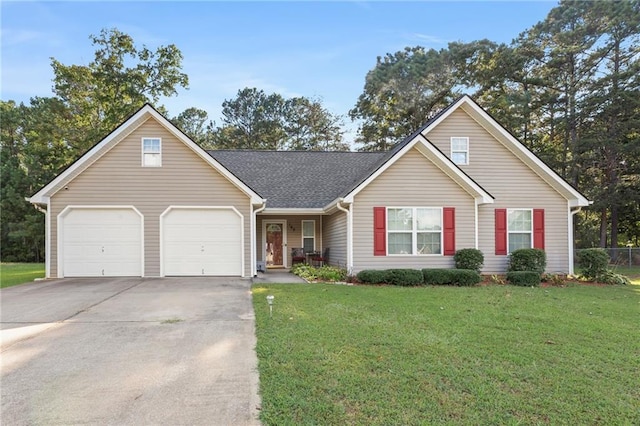 view of front of home featuring a front lawn and a garage