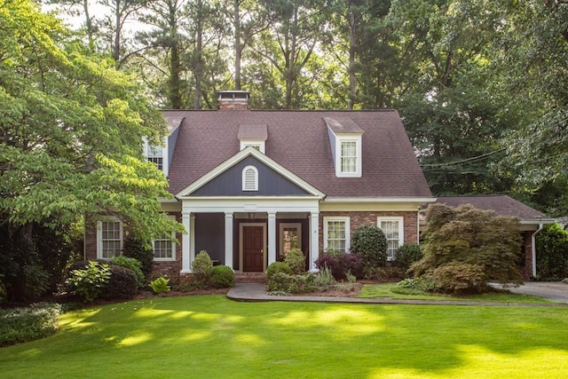 view of front of house featuring a front yard and a porch