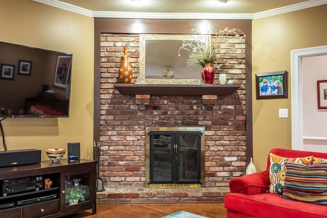 living room featuring dark hardwood / wood-style flooring, a brick fireplace, brick wall, and ornamental molding