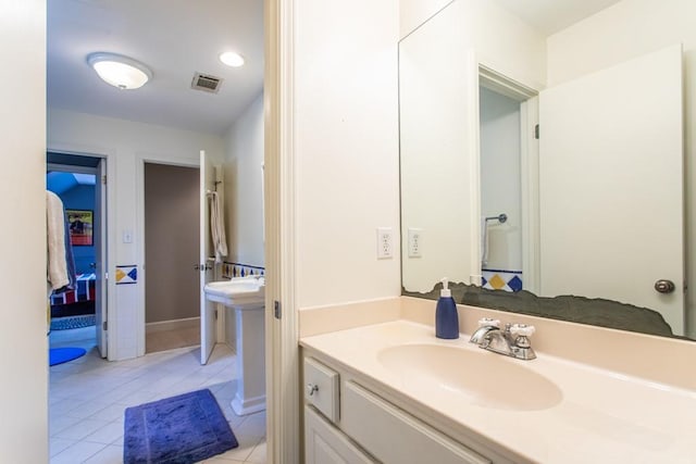 bathroom featuring tile flooring and sink