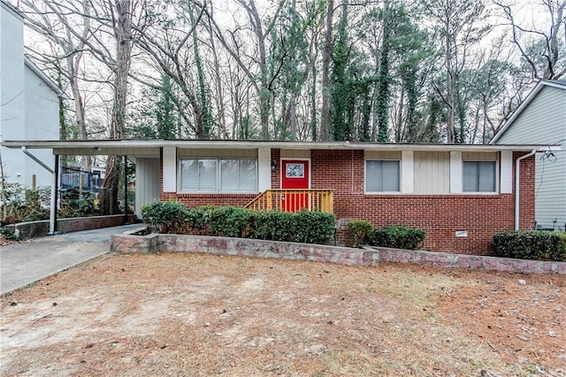 single story home featuring a carport