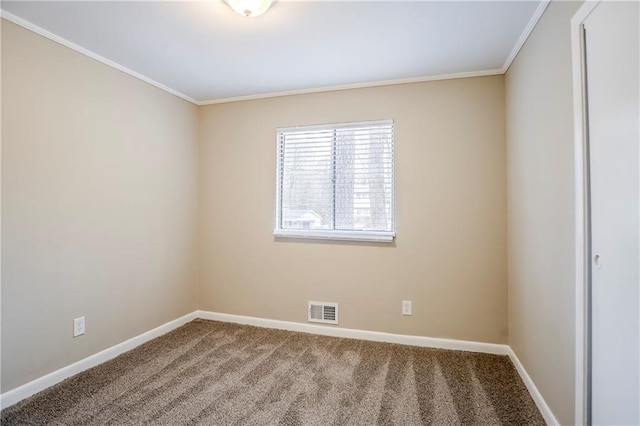 unfurnished room with ornamental molding and carpet