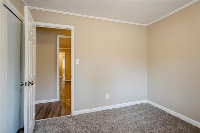 carpeted spare room with ornamental molding